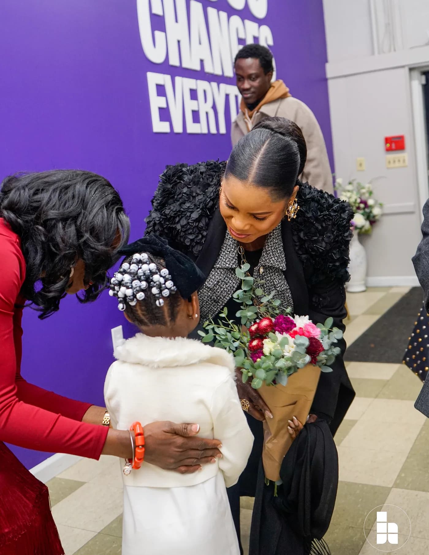 A member of the welcome team greeting a guest