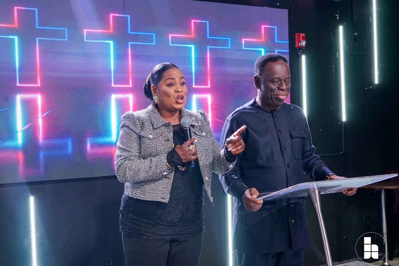 Two leaders speaking to the congregation