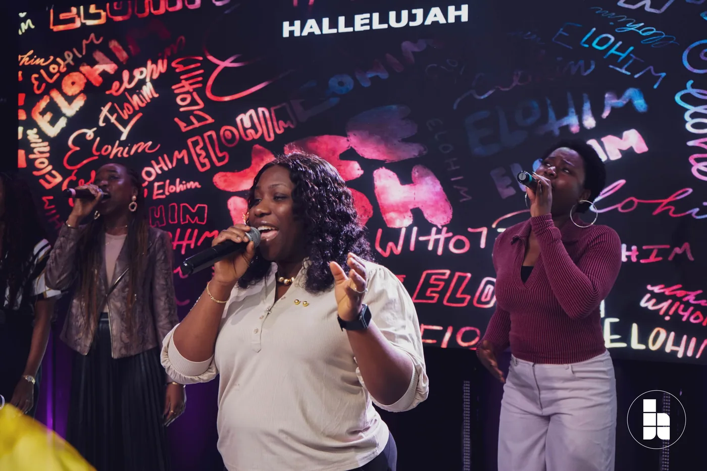 A worship leader singing at Jubilee Place