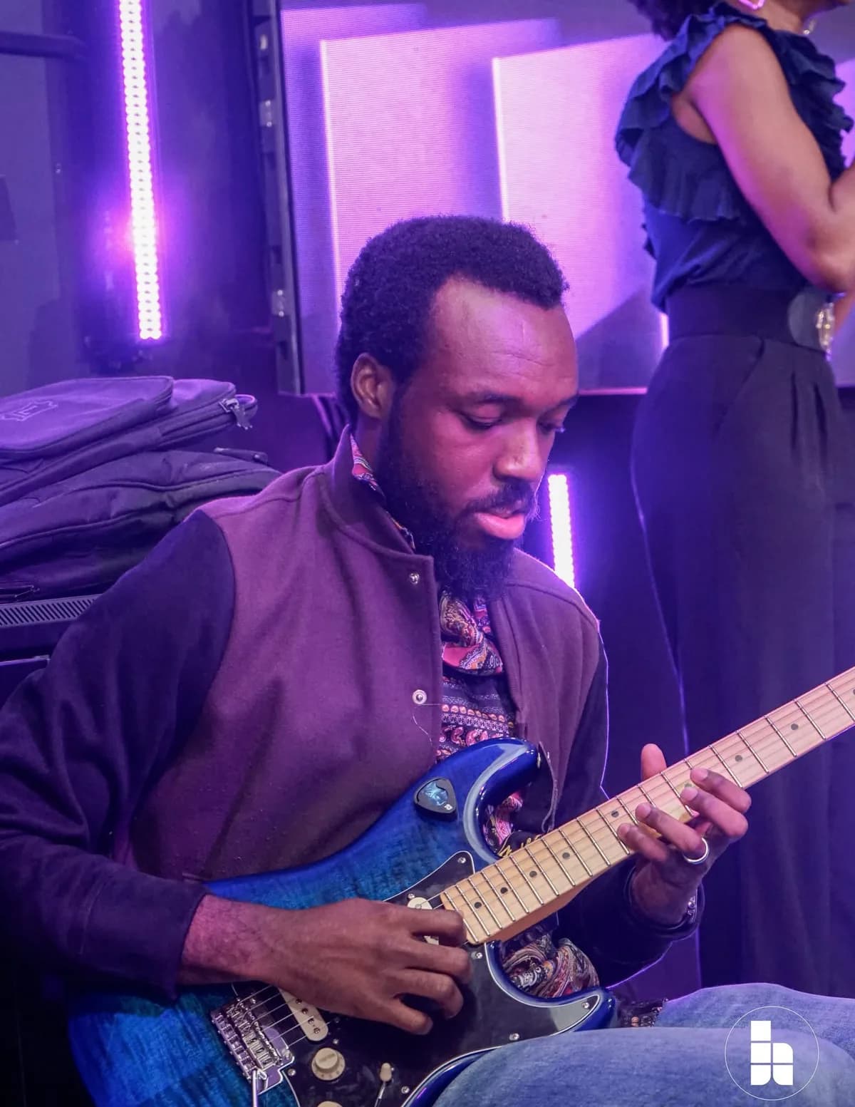 A guitarist playing during a Sunday service