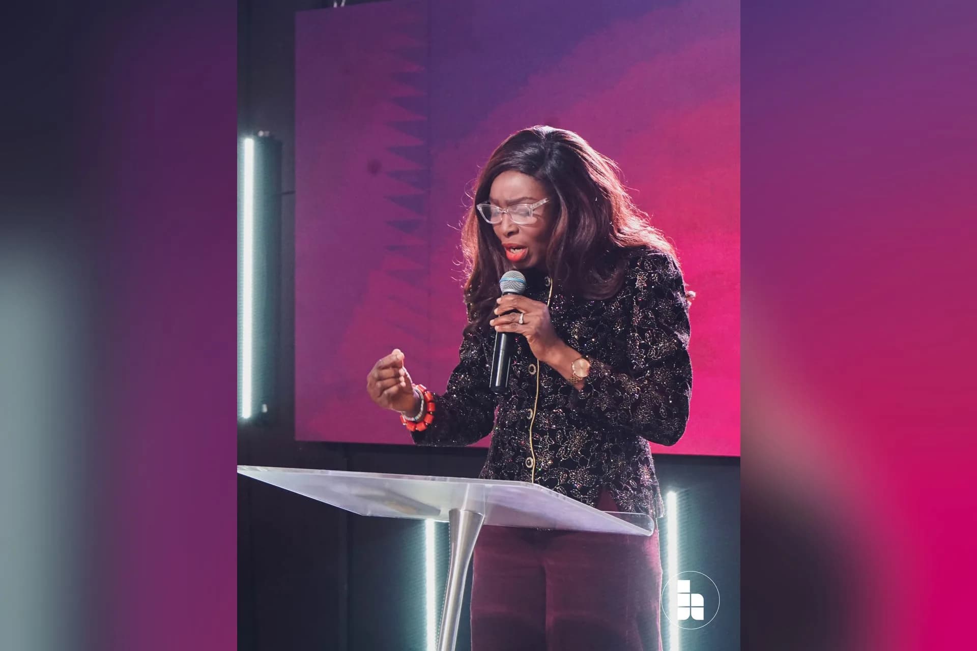 A pastor preaching from the platform at Jubilee Place