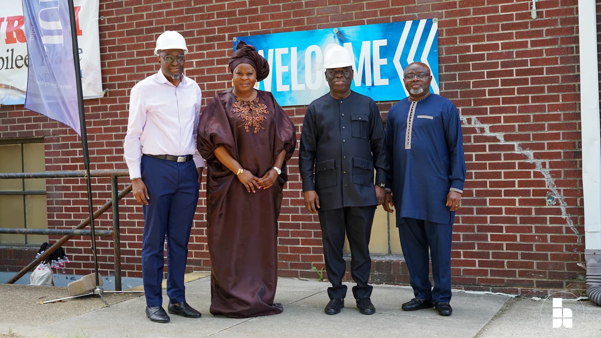 Jubilee Place leaders outside the church, beside the welcome banners