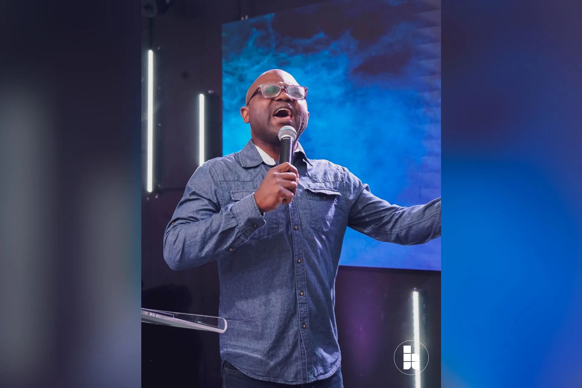 A pastor preaching during a gathering at Jubilee Place