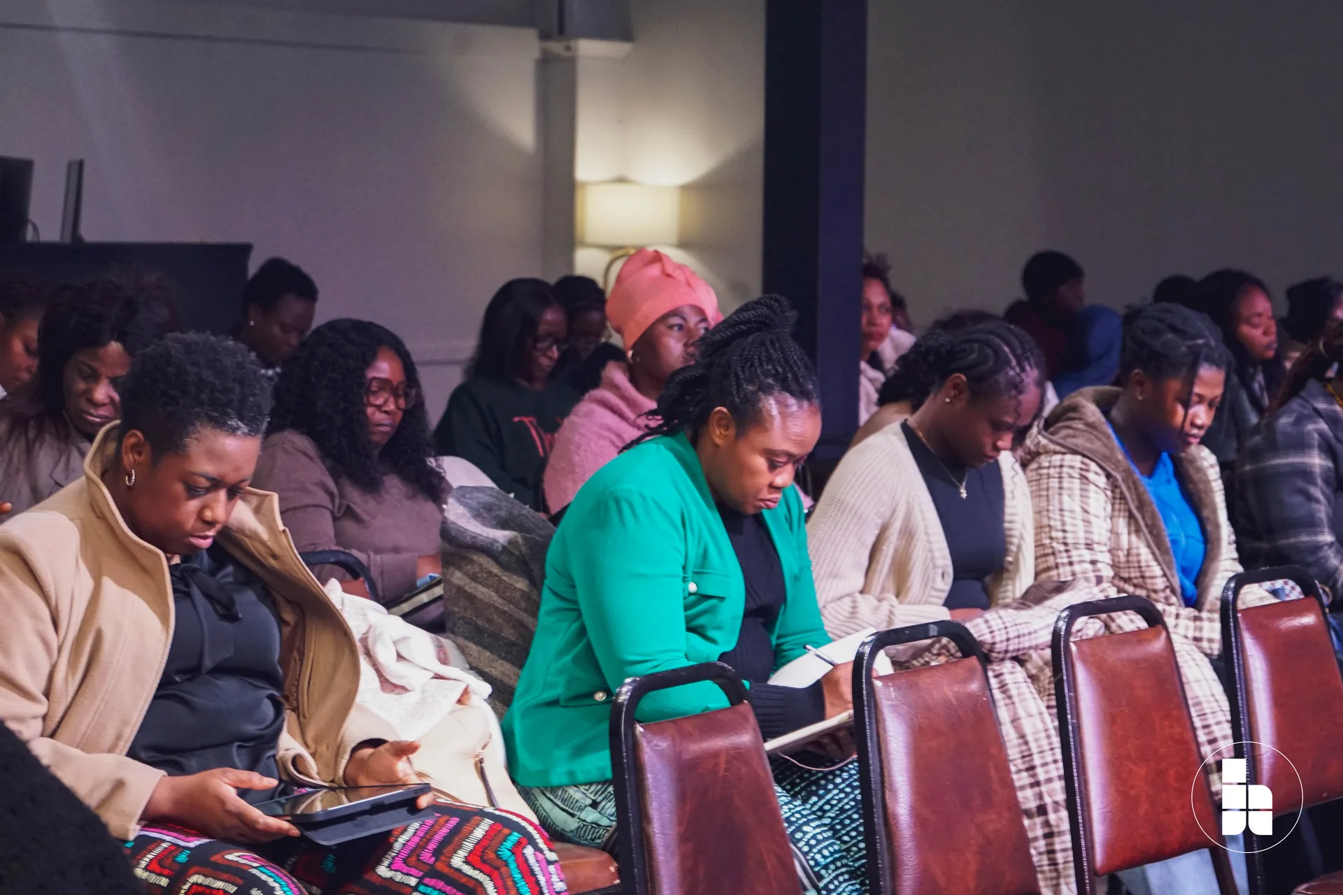 The congregation seated in prayer