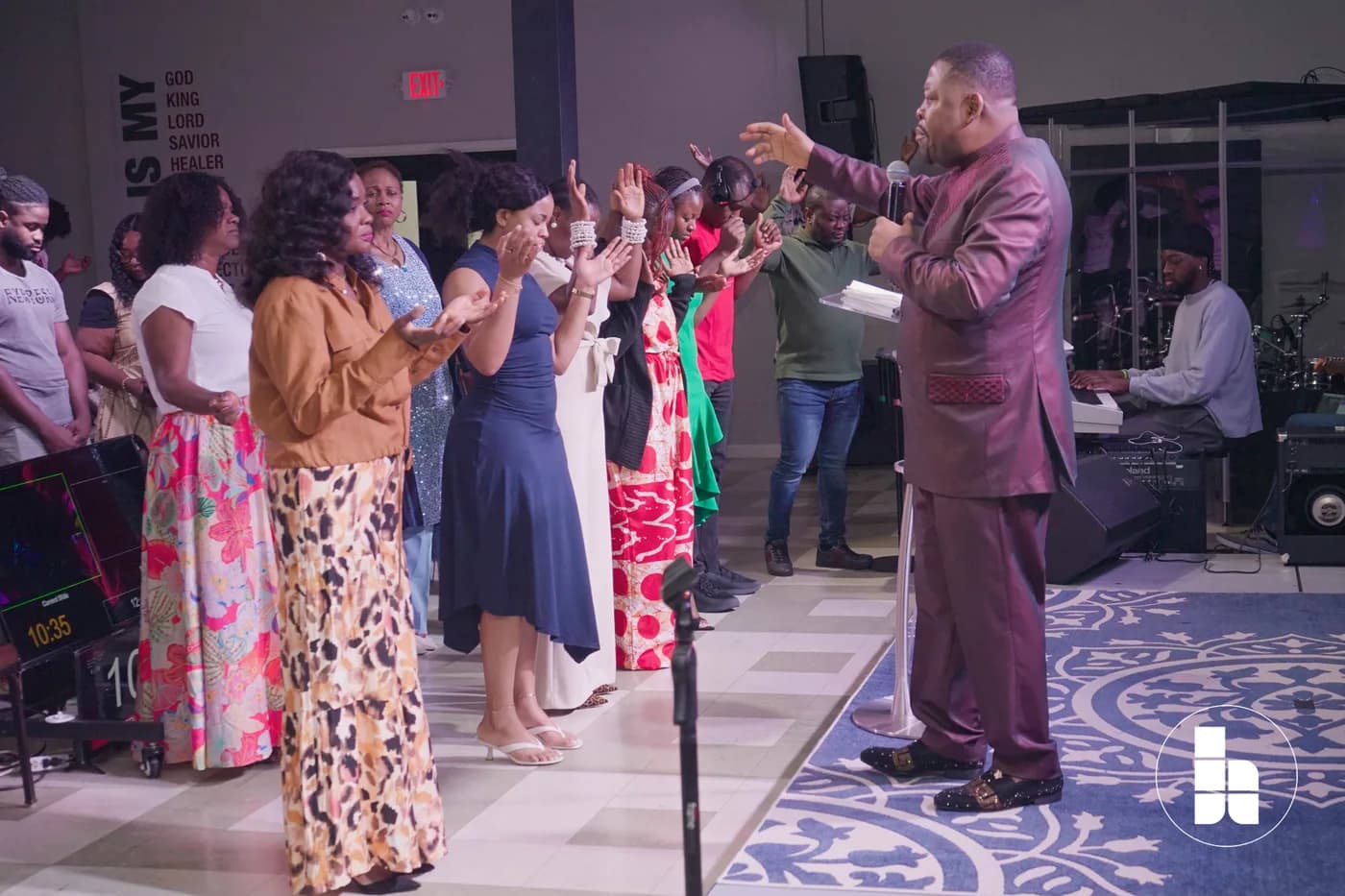 The congregation standing together in worship