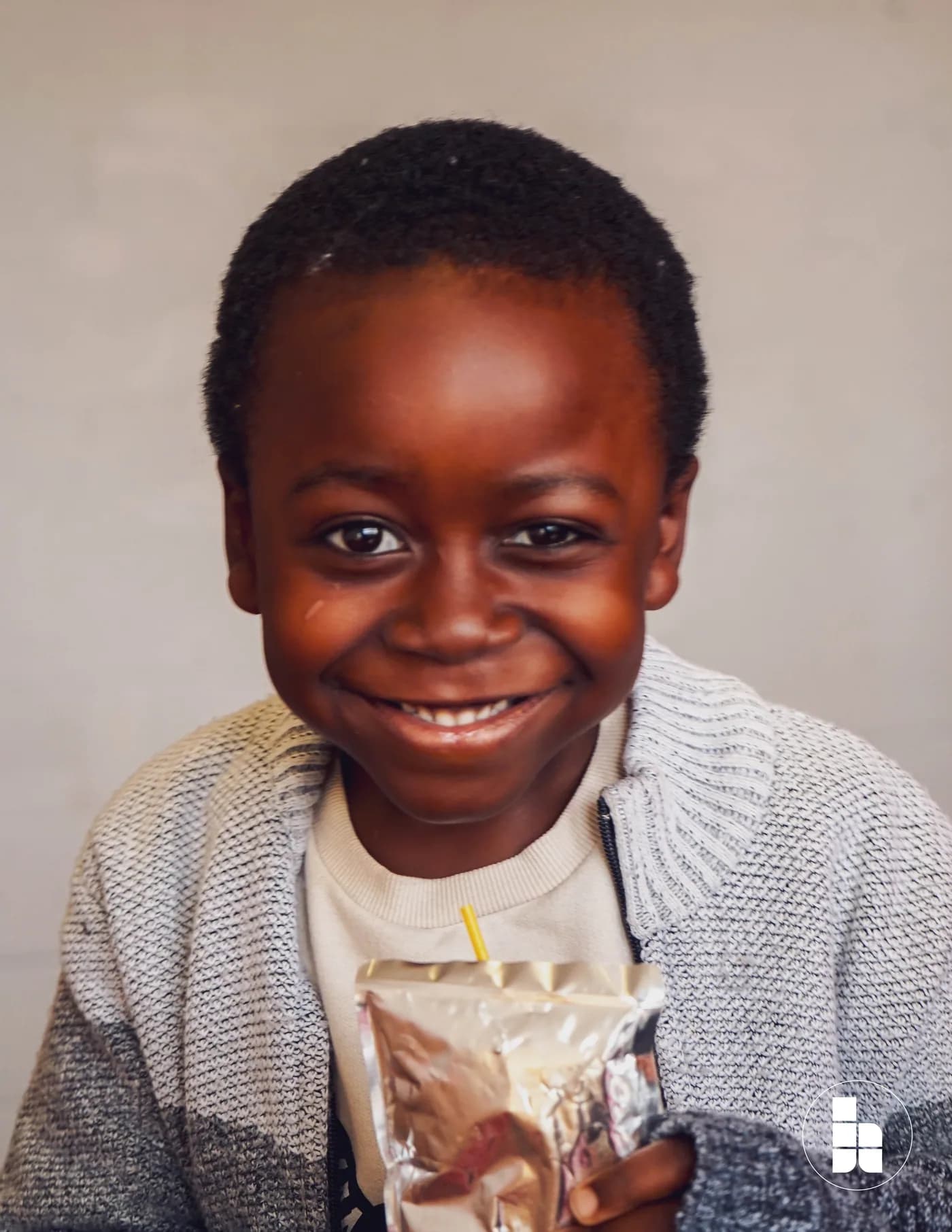 A child smiling during Jubilee Kids