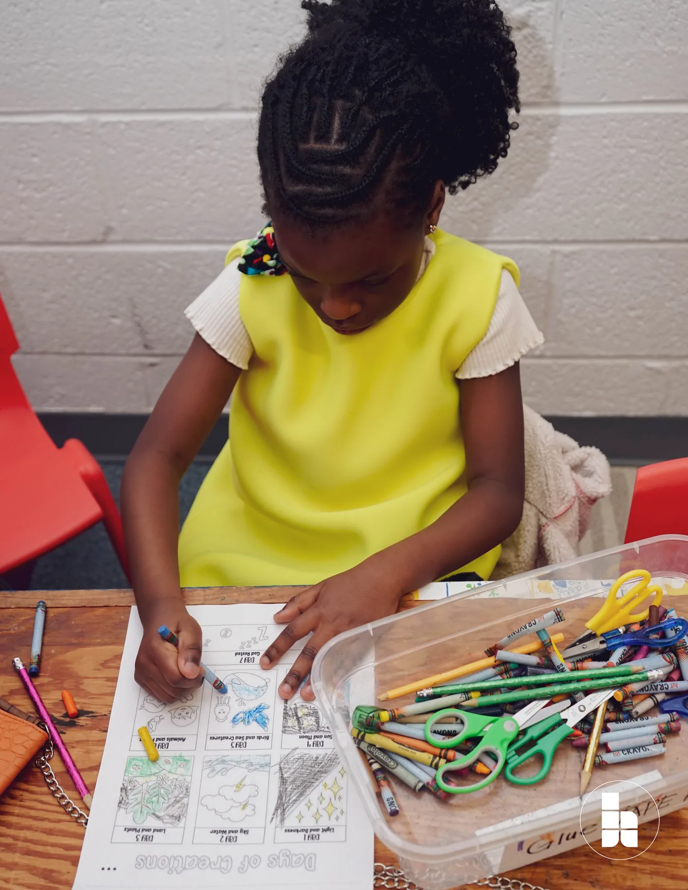 A child colouring during a Jubilee Kids session