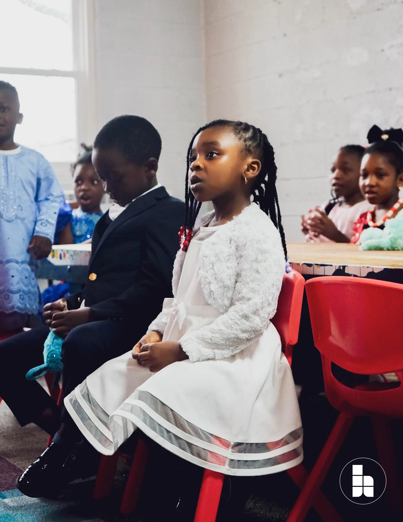 Younger members seated together during a service